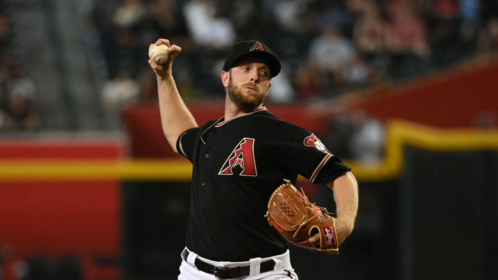 Andrew Chafin of the Arizona Diamondbacks delivers a pitch against News  Photo - Getty Images